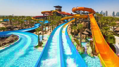 Aerial view of Aquaventure World Dubai, showcasing water slides and attractions Aerial view of Aquaventure World Dubai, showcasing water slides and attractions